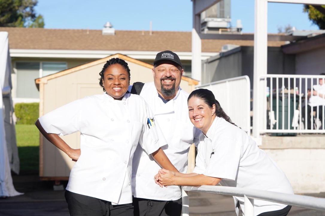 Photo of Jen and 2 Apprentices outside